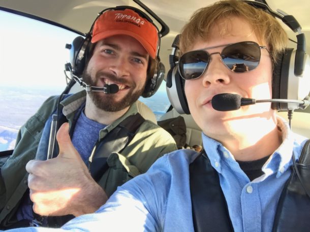 Photo of two people flying together in a small plane Photo of two people flying together in a small plane